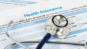Stethoscope on a health insurance form, illustrating ICHRA for employees.