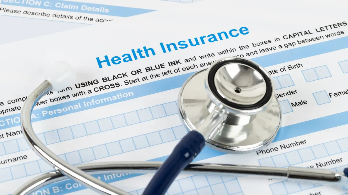 Stethoscope on a health insurance form, illustrating ICHRA for employees.